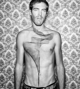 Man chest tattoo by Chaim Machlev