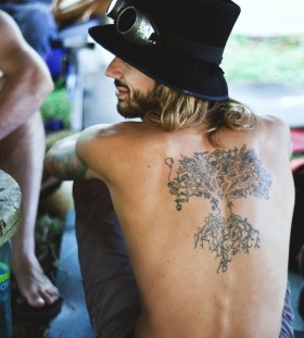 Men's back tree tattoo