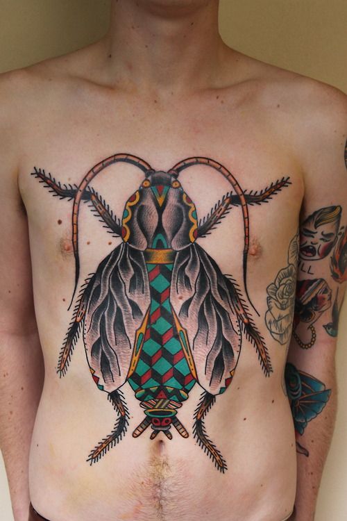Men’s chest insect tattoo