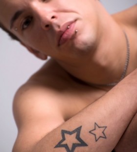 Men's hand and star tattoo