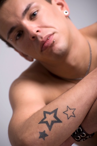 Men’s hand and star tattoo
