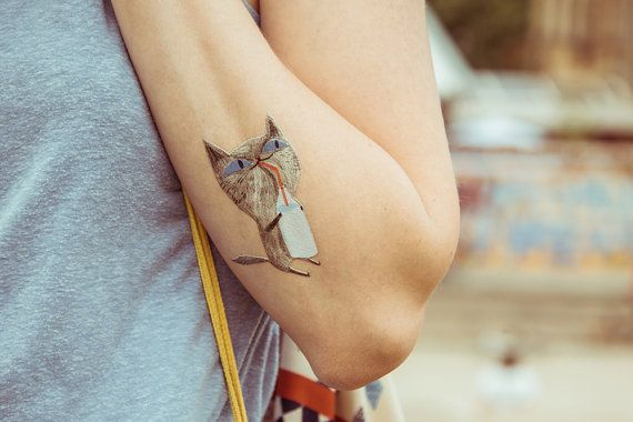 Pretty cat tattoo made by Berlin artist
