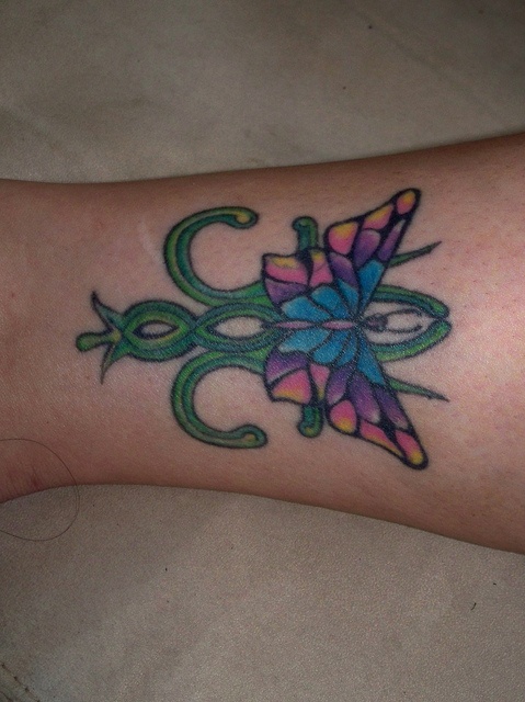 Purple butterfly tattoo