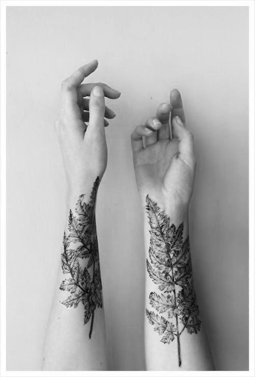Realistic hand leaf tattoo