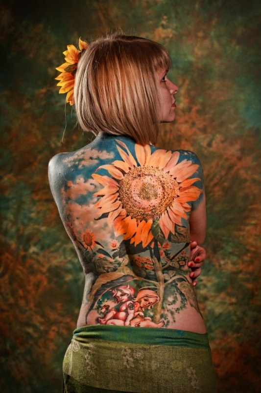 Realistic woman sunflower tattoo