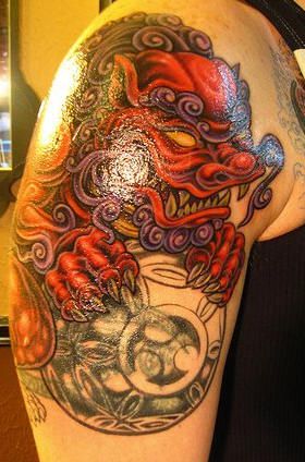 Red and black dragon tattoo