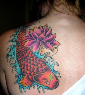 Red fish and lotus flower tattoo