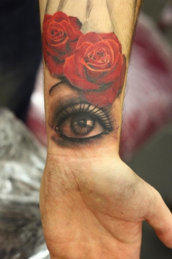 Red rose and eye tattoo