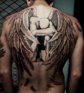 Sad angel wings tattoo