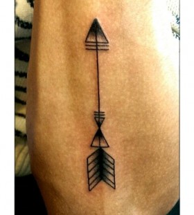 Simple black arrow tattoo