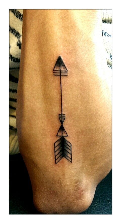 Simple black arrow tattoo