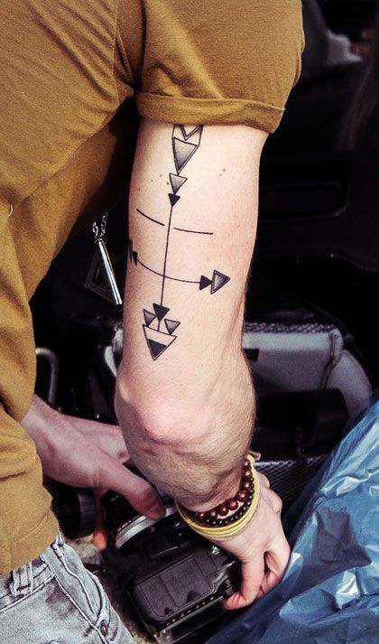 Simple men’s hand arrow tattoo
