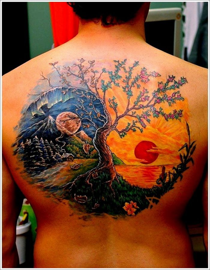 Sun and tree tattoo