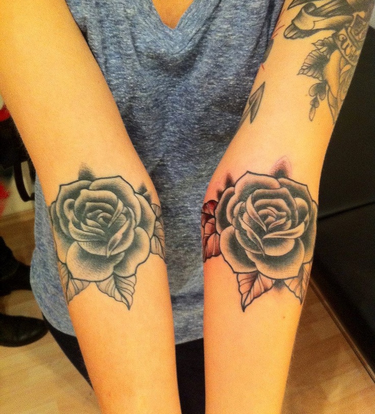 Two roses blue and red tattoo made by Berlin artist