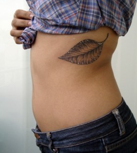 Woman pretty leaf tattoo