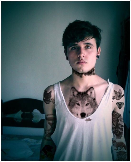 Young boy wolf tattoo on chest