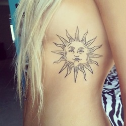 Absolutely amazing back sun tattoo