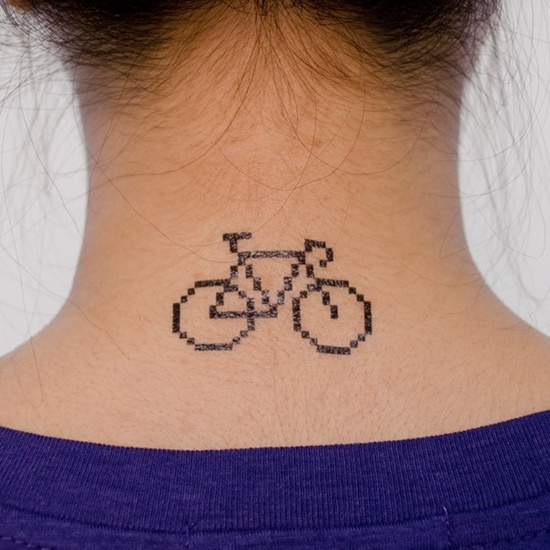 Adorable black bicycle tattoo on back