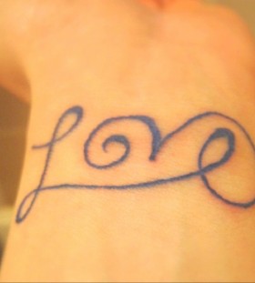 Adorable black love tattoo on arm