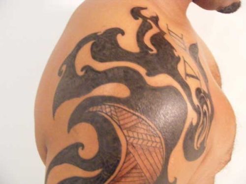 Adorable black tribal tattoo on shoulder