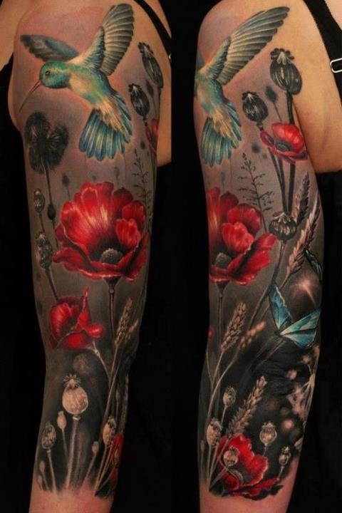 Adorable blue bird and flower tattoo on hand