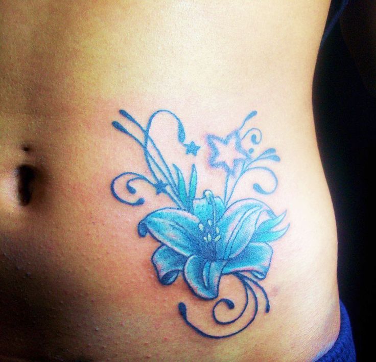 Adorable blue star and flower tattoo