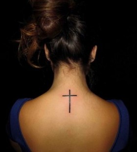 Adorable girl's back cross tattoo