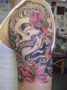 Adorable pink flower skull tattoo on leg