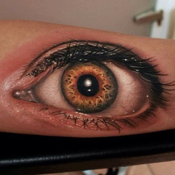 Adorable realistic eye tattoo on arm