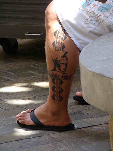Adorable soldier and tribal tattoo on leg