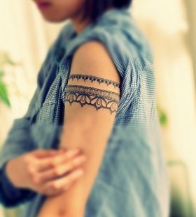 Adorable women lace tattoo on arm