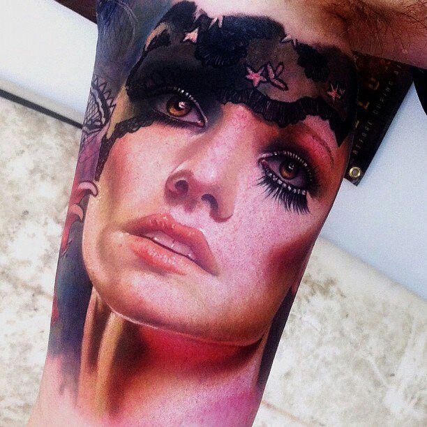 Adorable women’s face tattoo on arm