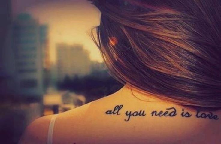 All you need is love quote tattoo on arm