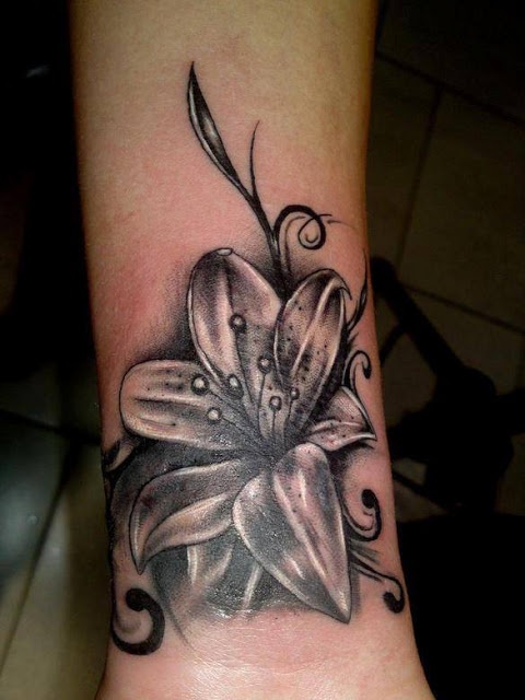Amaizing black flower tattoo on leg