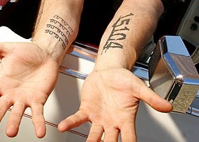 Amazing black number tattoo on arm