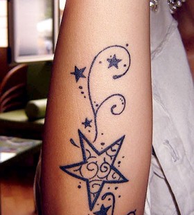 Amazing black star tattoo on arm