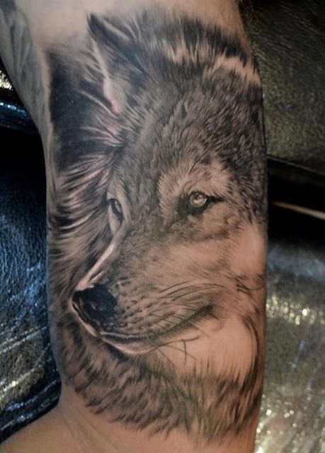 Amazing black wolf tattoo on arm