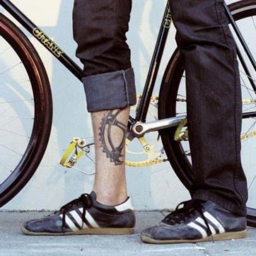 Amazing boy bicycle tattoo on leg