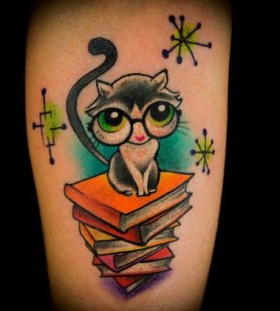 Amazing, cute big eyes cat book tattoo on arm