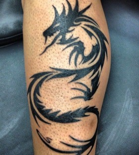 Amazing dragon tribal tattoo on leg