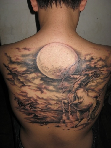 Amazing full back moon tattoo