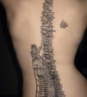 Amazing girl and back book tattoo