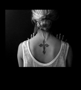 Amazing girl's back cross tattoo