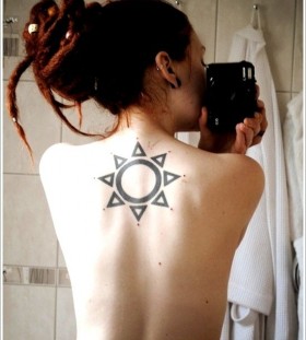 Amazing girl's back sun tattoo