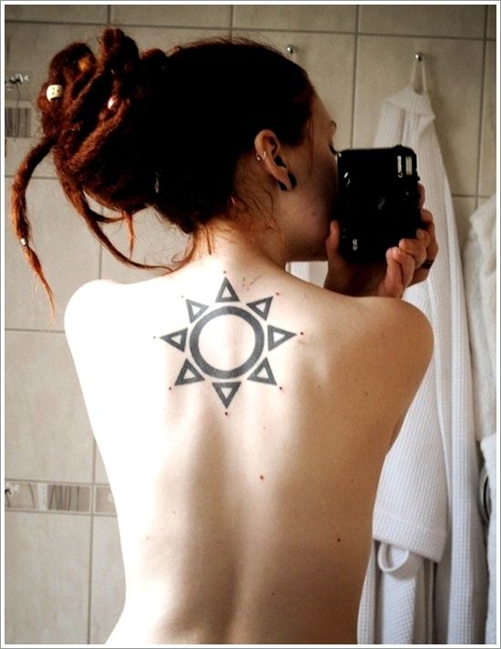 Amazing girl’s back sun tattoo