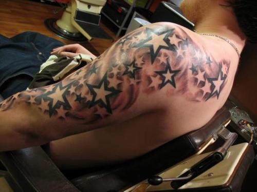 Amazing men star tattoo on shoulder