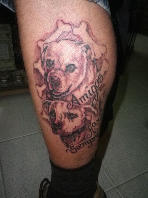 Amigos, bones and dog tattoo on leg