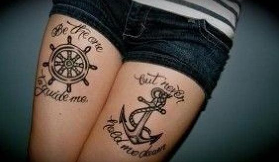 Anchor and detail of ship tattoo on leg