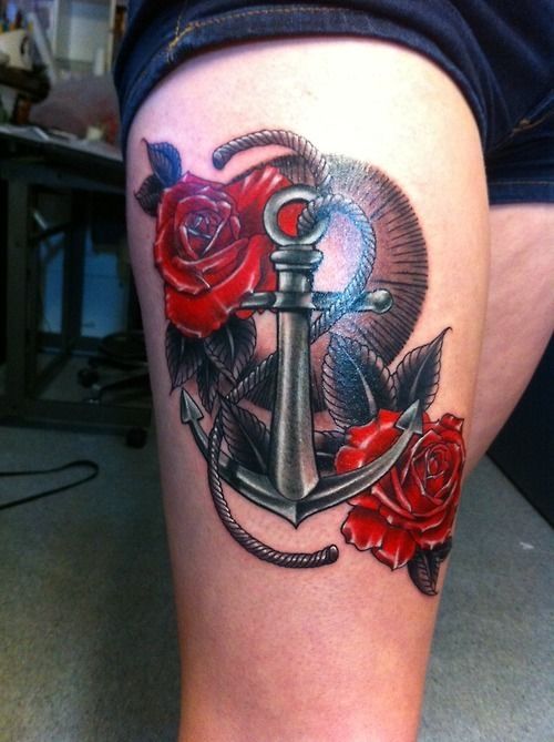 Anchor and red rose tattoo on leg