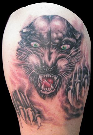 Angry big cat tattoo on arm